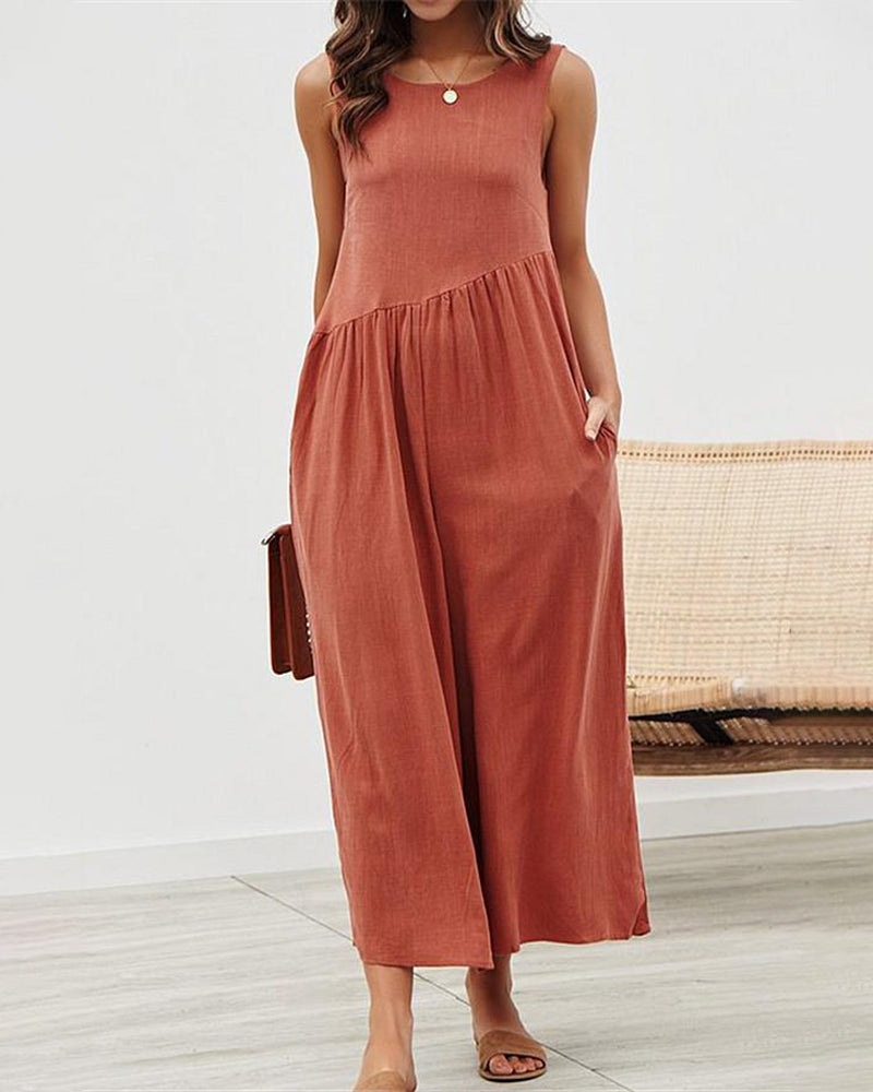 Sleeveless wide-leg jumpsuit in rust with tiered waist and relaxed floor-length hem