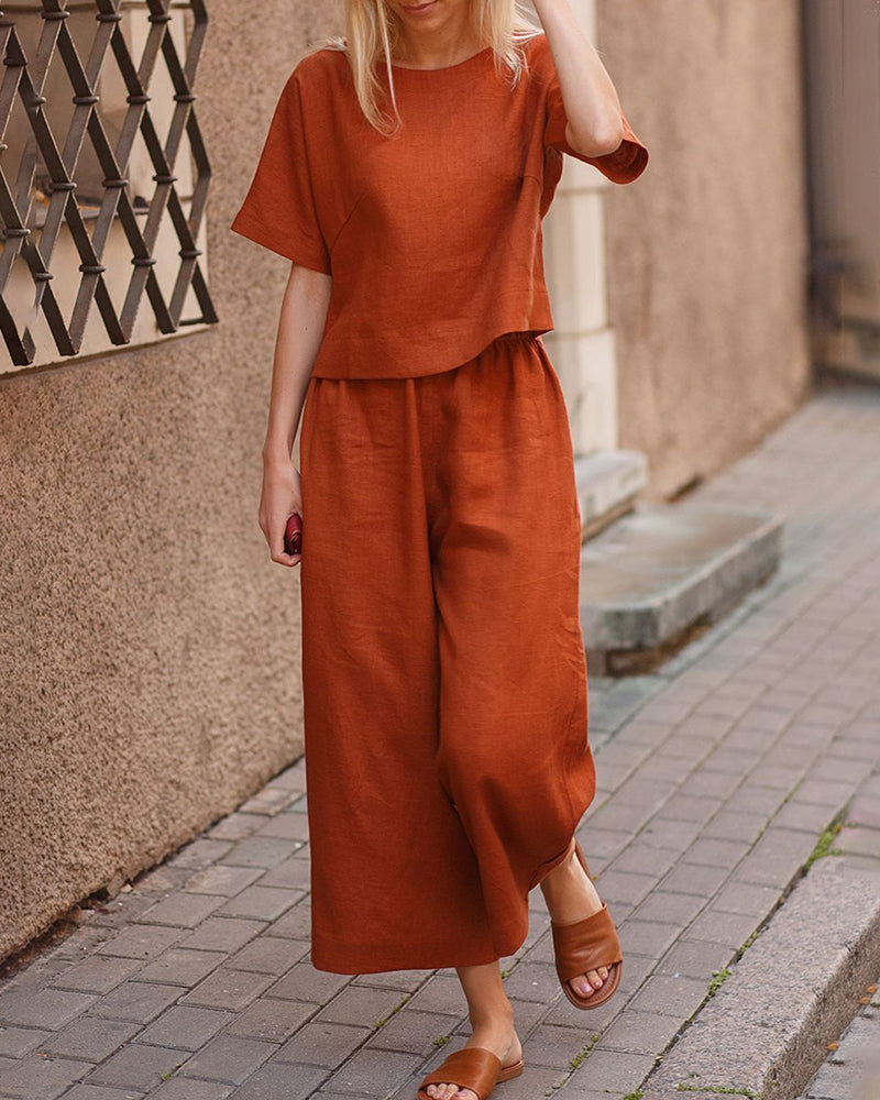 Rust two-piece set with loose T-shirt and wide-leg cropped pants