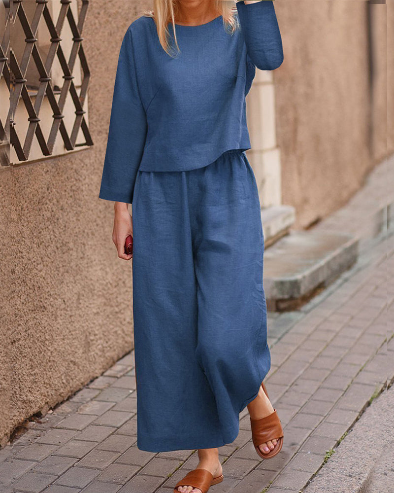 Blue long-sleeve two-piece set: layered top and wide-leg pants