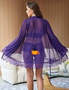 Purple sheer kimono robe with lace hem over matching lace panties and bralette