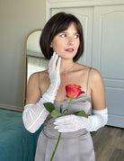 White long sheer mesh gloves with striped bands, wrist to finger fit on model.