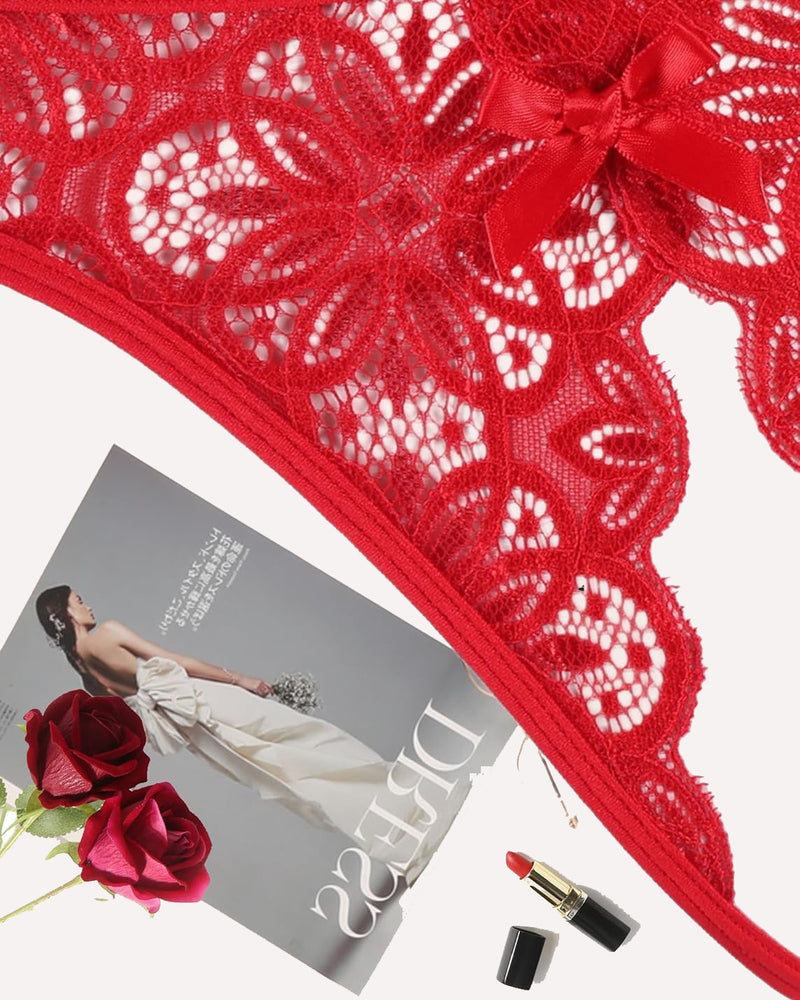 Close-up red lace thong briefs with bow, floral cutwork and scalloped trim.