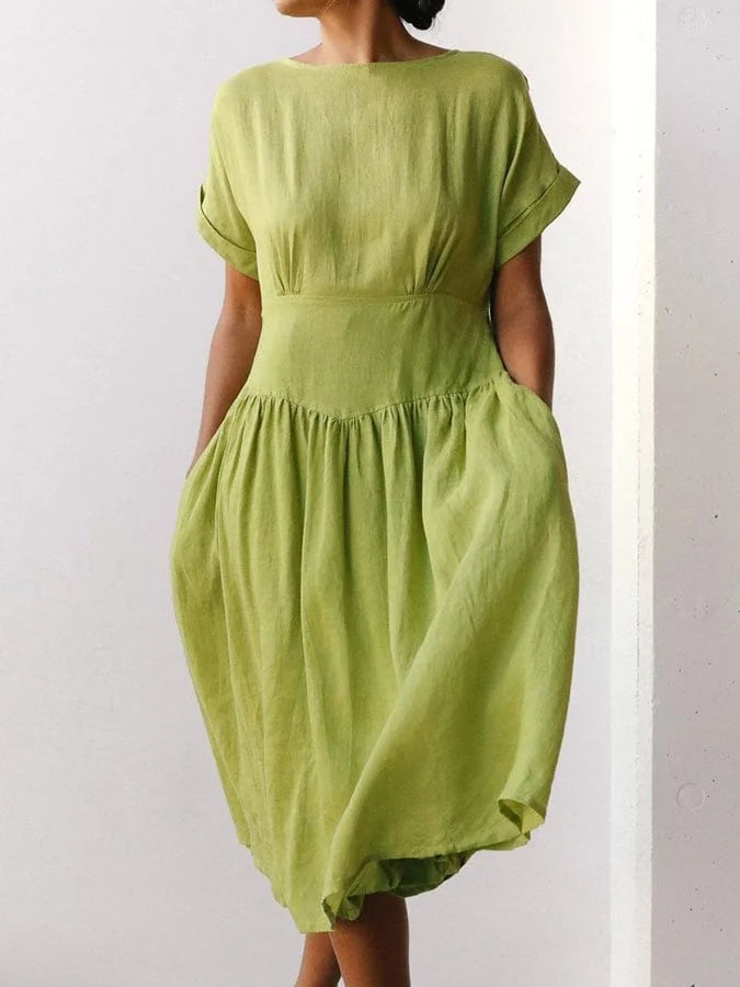 Grass green linen midi dress with short sleeves, gathered waist and full tiered skirt
