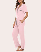 Women's pink notch-collar pajama set, short-sleeve button top with pocket and long pants.