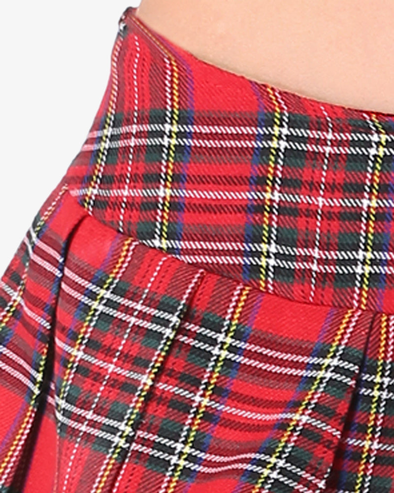 Red plaid mini skirt close-up with stitched grid pattern and pleated panels