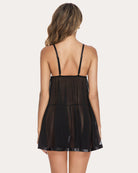 Black mesh babydoll from back view with thin straps and scalloped lace trim