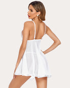 White mesh babydoll from back view with thin straps and scalloped lace trim