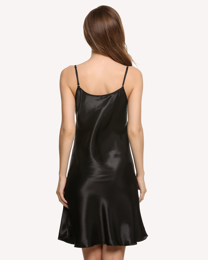 Black satin slip dress with thin spaghetti straps, open back, knee-length