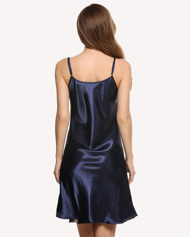 Dark blue satin slip dress with thin spaghetti straps, open back, knee-length