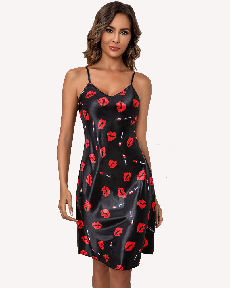 Black satin slip dress with red lips and small graphic accents, spaghetti straps, V-neck