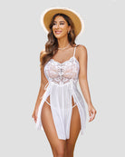 White lace babydoll dress with thin straps, corset bodice, and asymmetrical sheer sides