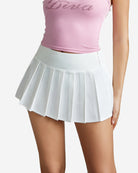 White mini pleated skirt with elastic waistband and crisp vertical pleats