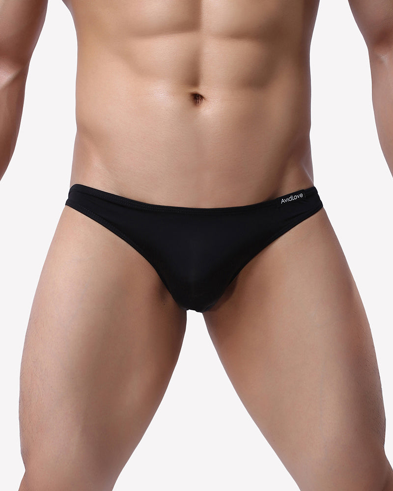 Men's low-rise stretch briefs, black, front view on model