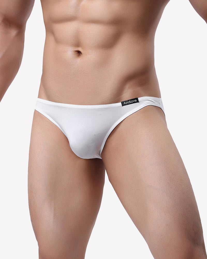 Men's low-rise briefs in white on model with elastic waistband
