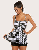Two-piece tankini set with black-and-white striped tank, center bow detail, and black shorts