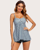 Two-piece tankini set with printed white-and-blue-green tank and black swim shorts