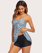 Two-piece tankini set with white printed tank top and black swim shorts, front diagonal view