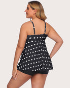 Black polka-dot tankini top with open back and matching swim shorts