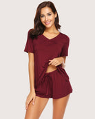 Dark red short-sleeve pajama set with V-neck top and matching drawstring shorts