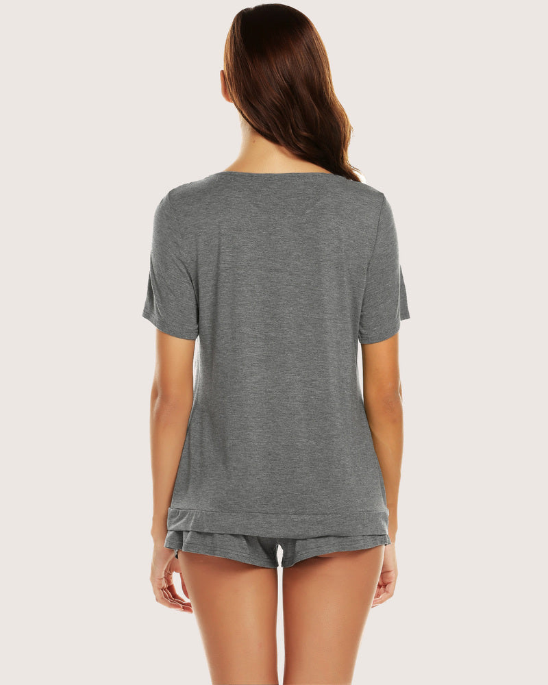 Women's grey pajama set, back view: short-sleeve top and tied-waist shorts