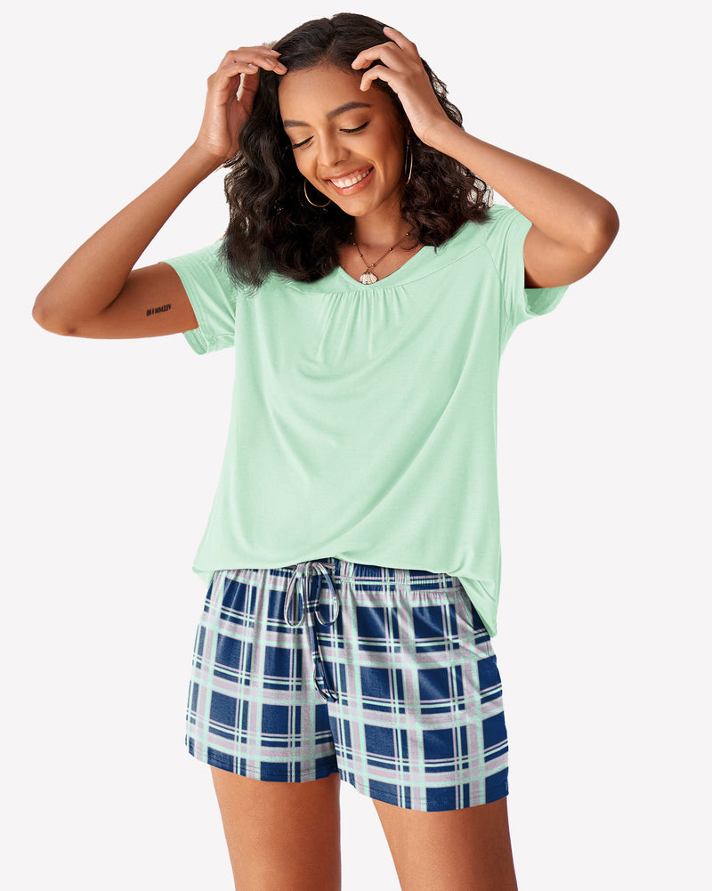 Mint green short-sleeve pajama set with blue-and-white plaid drawstring shorts
