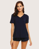 Navy blue short-sleeve pajama set with V-neck top and matching drawstring shorts