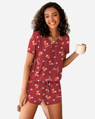 Maroon Christmas pajama set with candy and snowflake print; drawstring shorts
