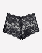 Mid-rise lace panties in black, floral lace pattern, scalloped trim, bow detail.