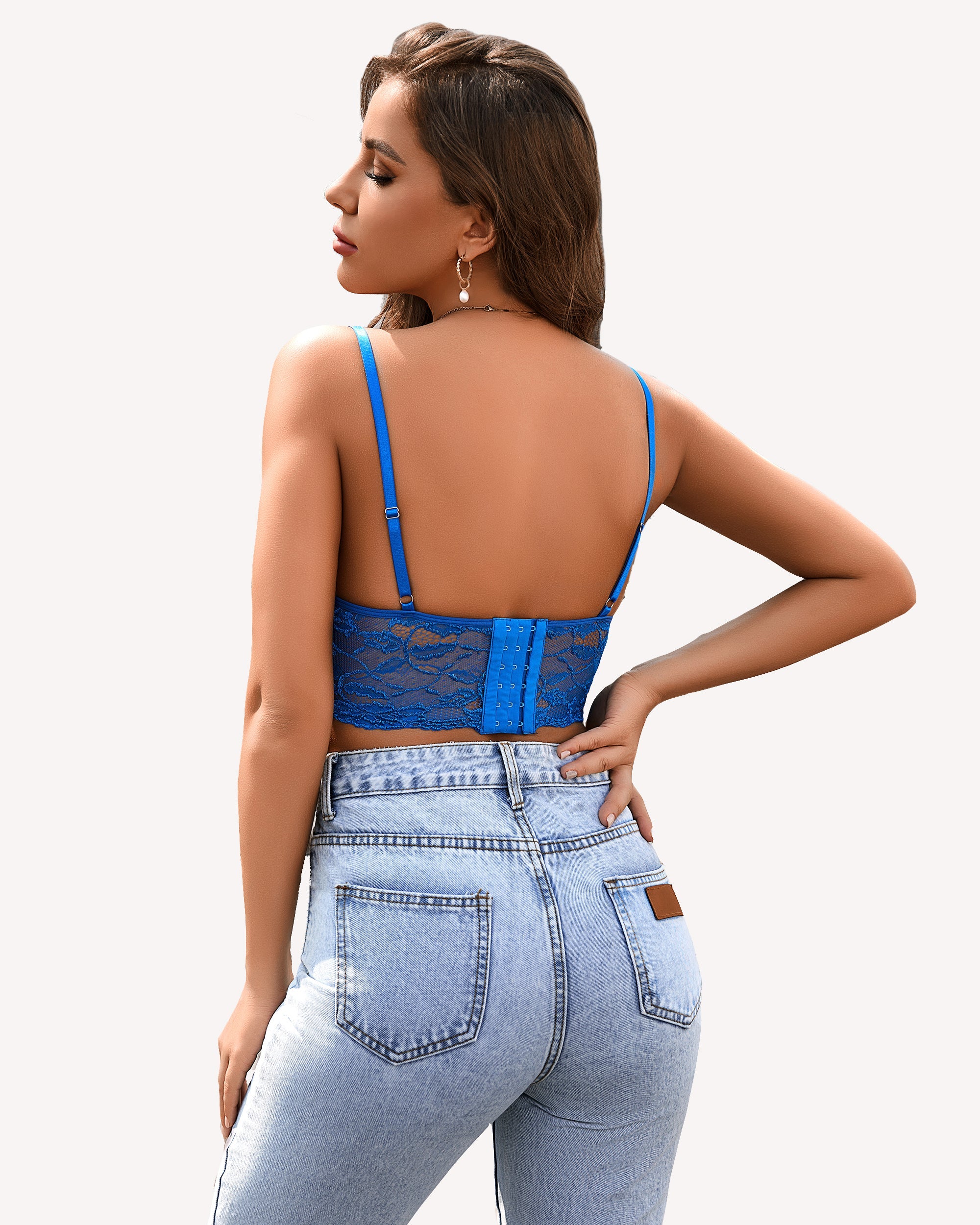 Blue lace crop top bra from back with thin adjustable straps and vertical panel