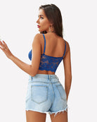 Blue lace bralette crop top with thin spaghetti straps and open-back design