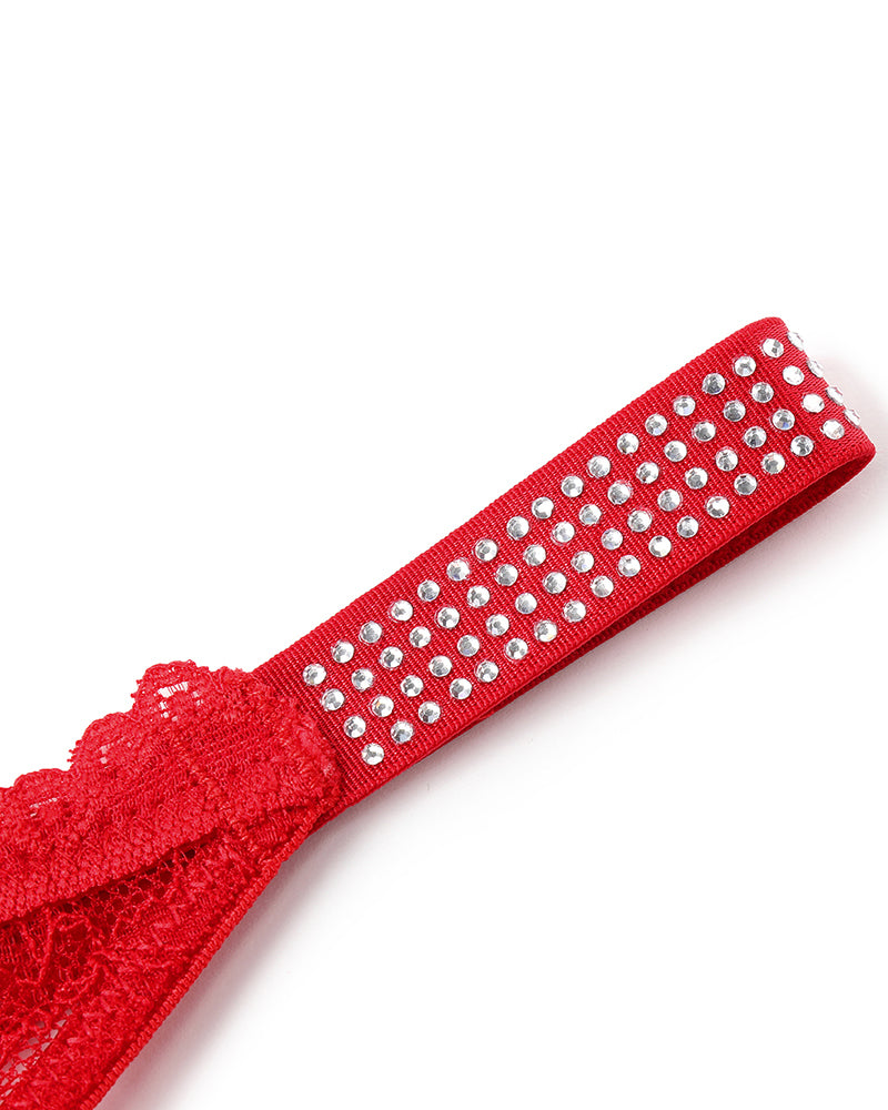 Red lace thong strap with rhinestone studs across the top
