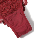 Burgundy lace glitter cheeky panty close-up with scalloped lace and elastic hem.