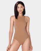 Tan double-lined sleeveless bodysuit shapewear with high neckline and thong bottom.