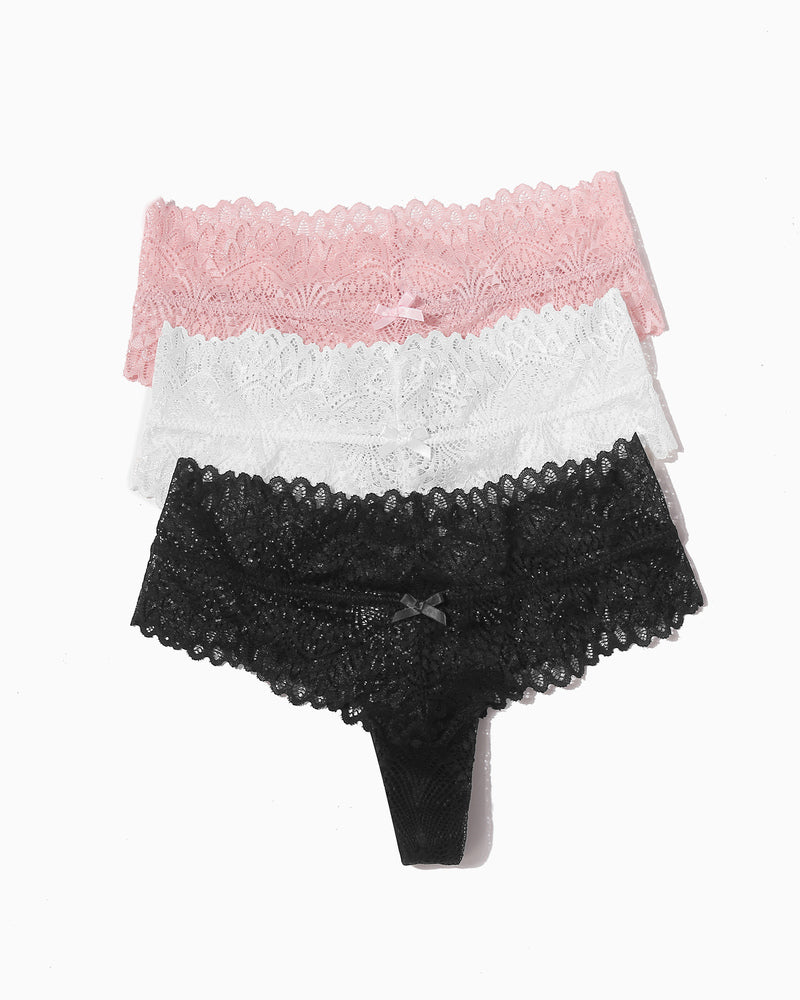Layered lace low-waist thongs in pink, white, and black with bows