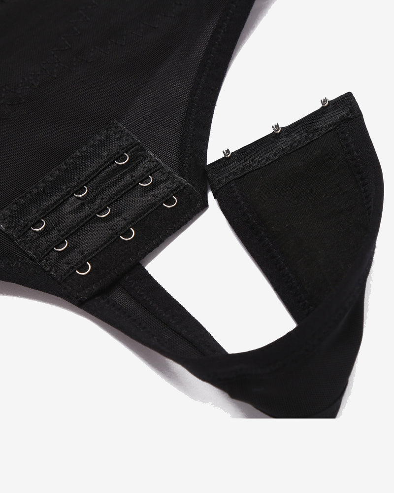 Black shapewear thong showing adjustable hook-and-eye waistband straps