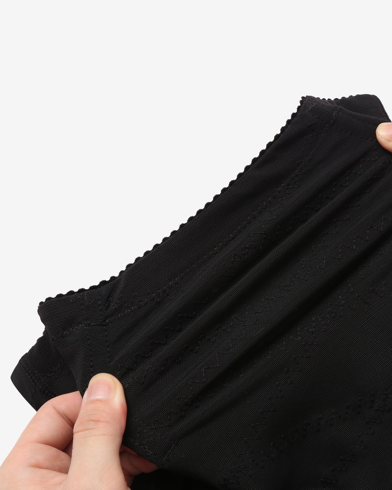 Black stretch fabric thong shapewear with seam details and reinforced band