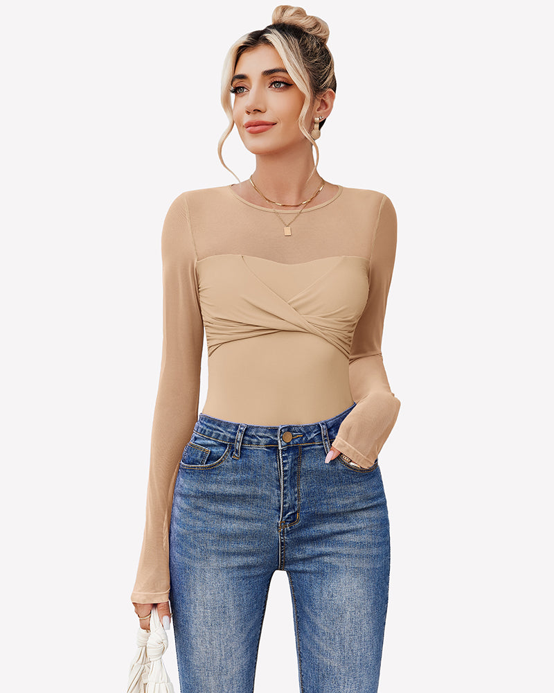 Nude sheer long sleeve leotard top with front twist knot, worn with jeans