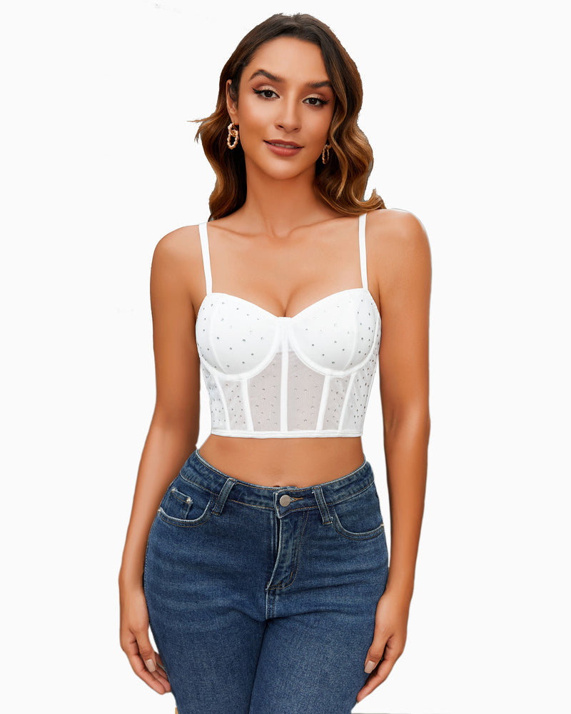 White corset push-up bustier top with rhinestone dots, worn with blue jeans
