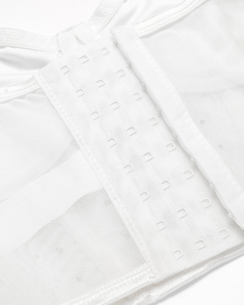 Close-up of white corset top boning and hook-and-eye back in textured fabric