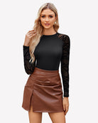 Black turtleneck mesh one-piece leotard with sheer geometric sleeves