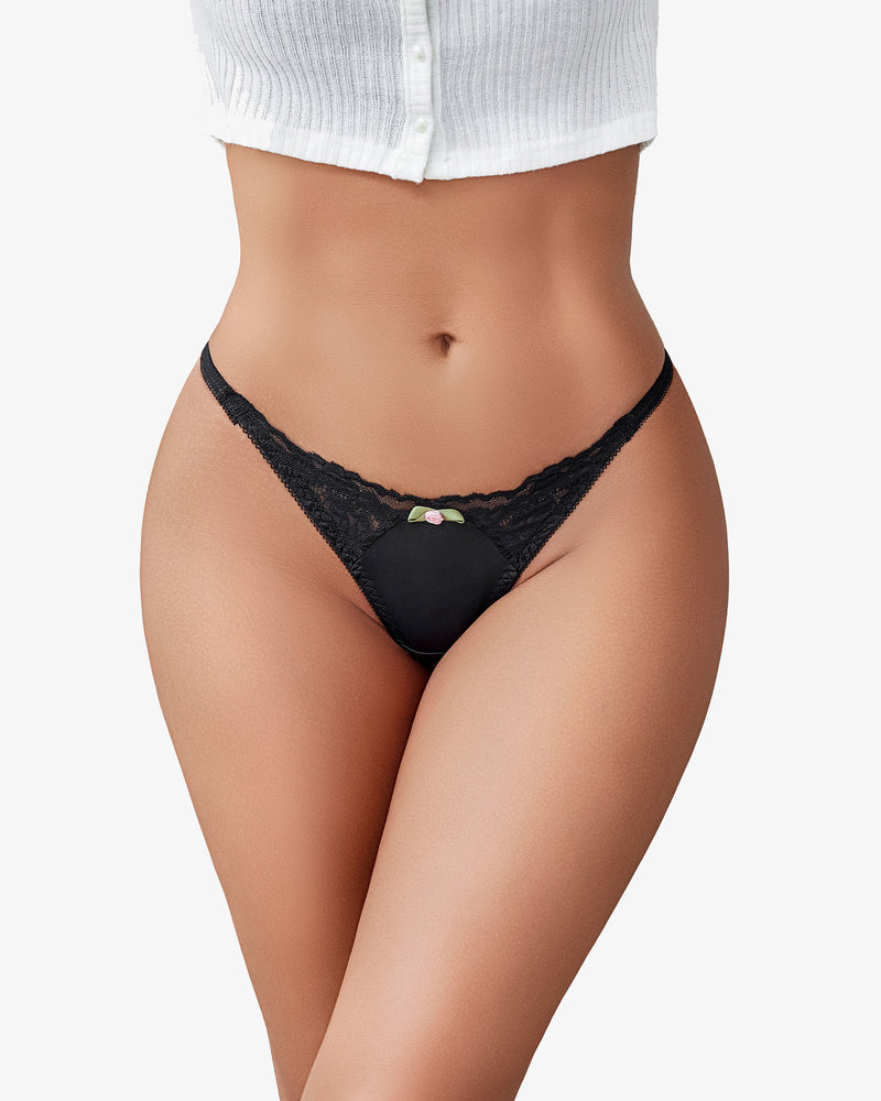Black lace g-string T-back thong with small rose-accented center on model