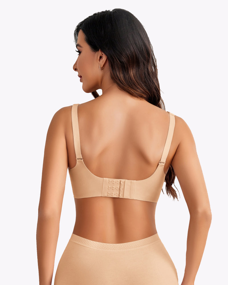 Back view of seamless nursing bra in light beige with adjustable straps and row of hooks.