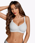 White seamless nursing bra with molded cups and adjustable straps, front view.