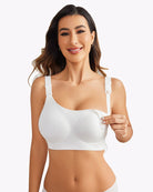 Wireless nursing bra in white with adjustable straps and visible nursing clip