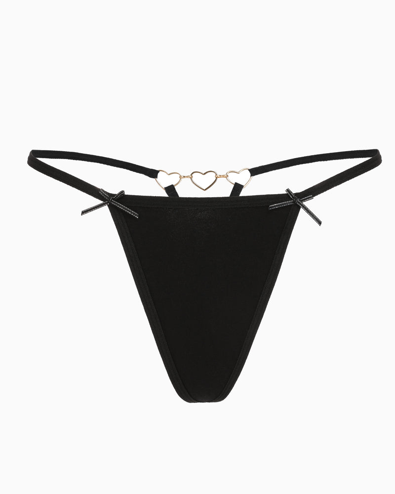 Black g-string thong with gold heart ring detail at the waistband and bow side ties