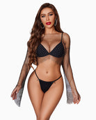 Black g-string thong with gold heart ring detail on the waistband, worn with a bra