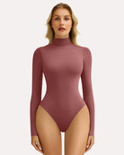 Rose red high-neck snap-closure bodysuit with long sleeves, fitted shaping style.
