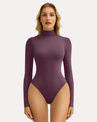 Purple high-neck snap-closure bodysuit with long sleeves, fitted shaping style.