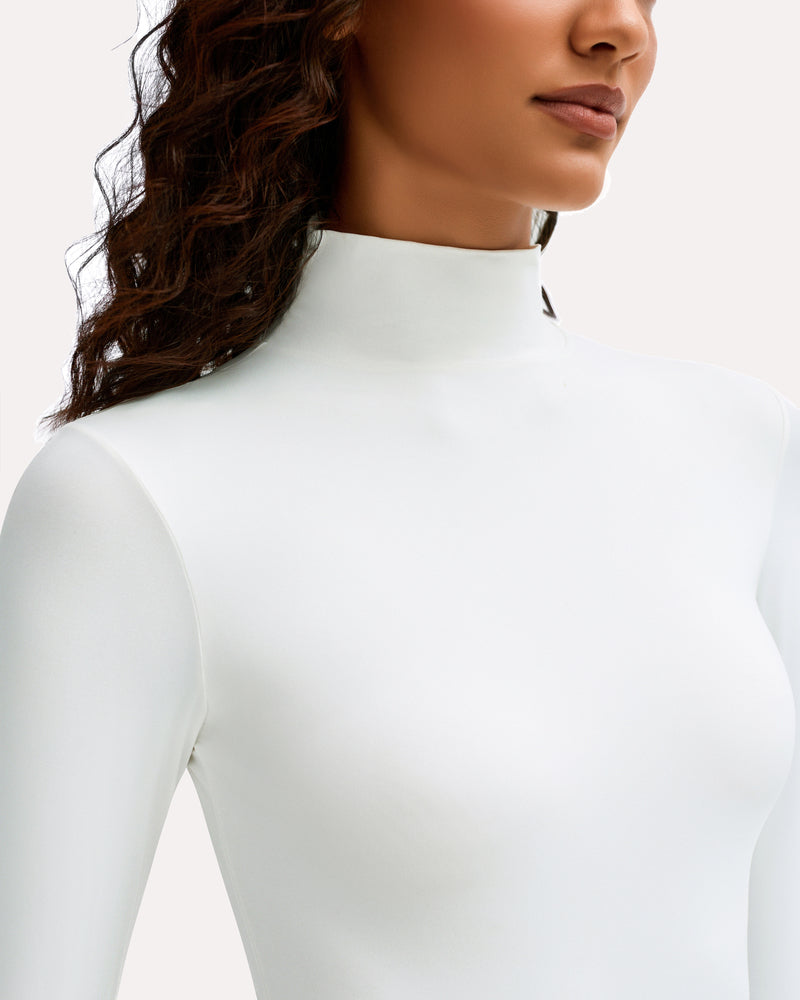 White high-neck long-sleeve soft bodysuit neckline close-up