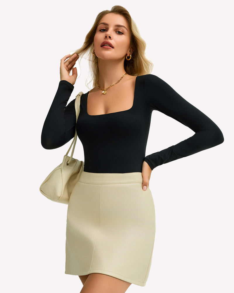 Double-lined square-neck bodysuit top, long sleeves, black, front with hand on hair